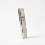 Hammered silver mezuzah case with Star of David, three-quarter angle view showing texture depth, handmade in Israel, Kameart