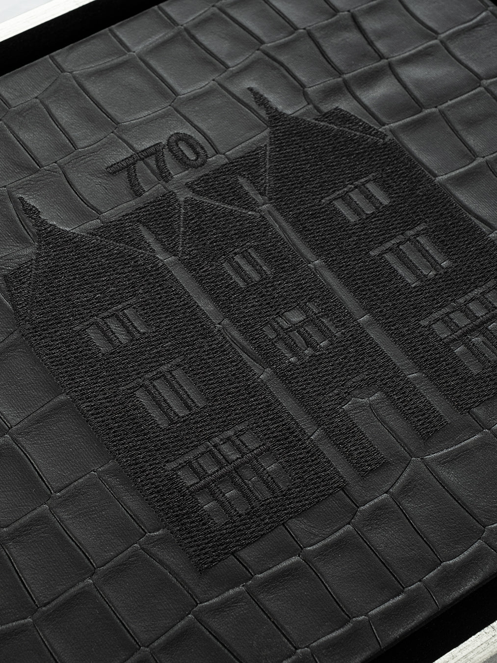 770 Eastern Parkway Wall Art, embroidery close-up detail, black crocodile-embossed leather, handmade in Israel, Kameart