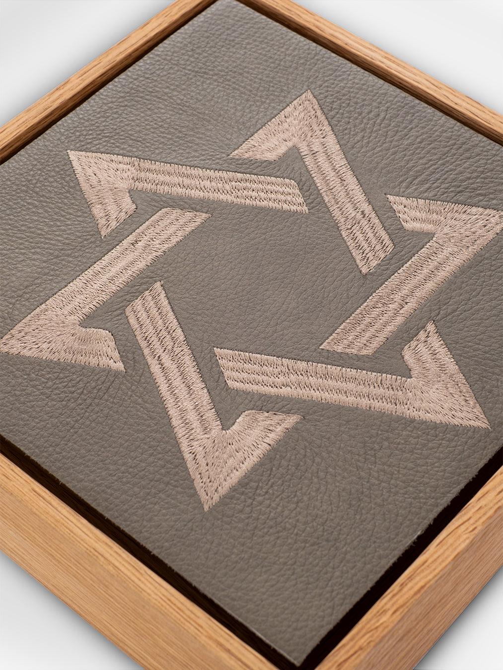 Magen David Wall Art, embroidery close-up detail, grey pebbled leather, oak frame, handmade in Israel, Kameart