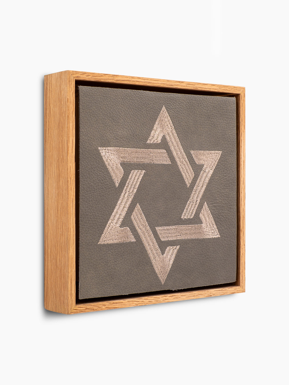 Magen David Wall Art, angled view, grey pebbled leather, oak frame, handmade in Israel, Kameart