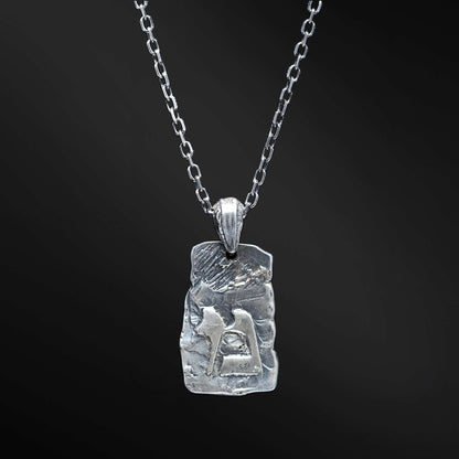 Dive into the symbolism of water and renewal with our Mem necklace. Crafted with a rectangular silver plate featuring the Hebrew letter &quot;מ,&quot; it holds a secret 770 reference, symbolizing spiritual guidance. This pendant embodies the qualities of rejuvenation, abundance, and spirituality, making it a powerful addition to your collection.