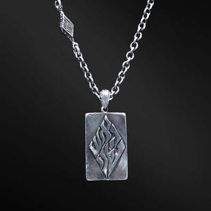 "Hidai Pendant: A collection of captivating images showcasing the fiery essence of the Hidai pendant. Engraved with the empowering words 'Aesh Sheli' (My Fire), it serves as a catalyst for passion and confidence. The precision craftsmanship of the square pendant radiates elegance and uniqueness, symbolizing your own distinct journey. Let these photos ignite your inner flame and empower you to shine boldly, embracing your true essence."