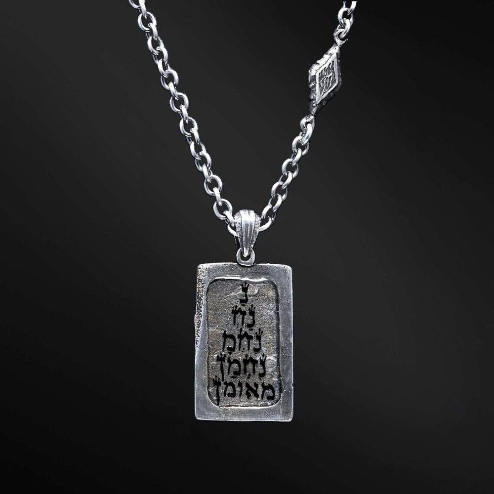 "Hidai Pendant: A collection of captivating images showcasing the fiery essence of the Hidai pendant. Engraved with the empowering words 'Aesh Sheli' (My Fire), it serves as a catalyst for passion and confidence. The precision craftsmanship of the square pendant radiates elegance and uniqueness, symbolizing your own distinct journey. Let these photos ignite your inner flame and empower you to shine boldly, embracing your true essence."