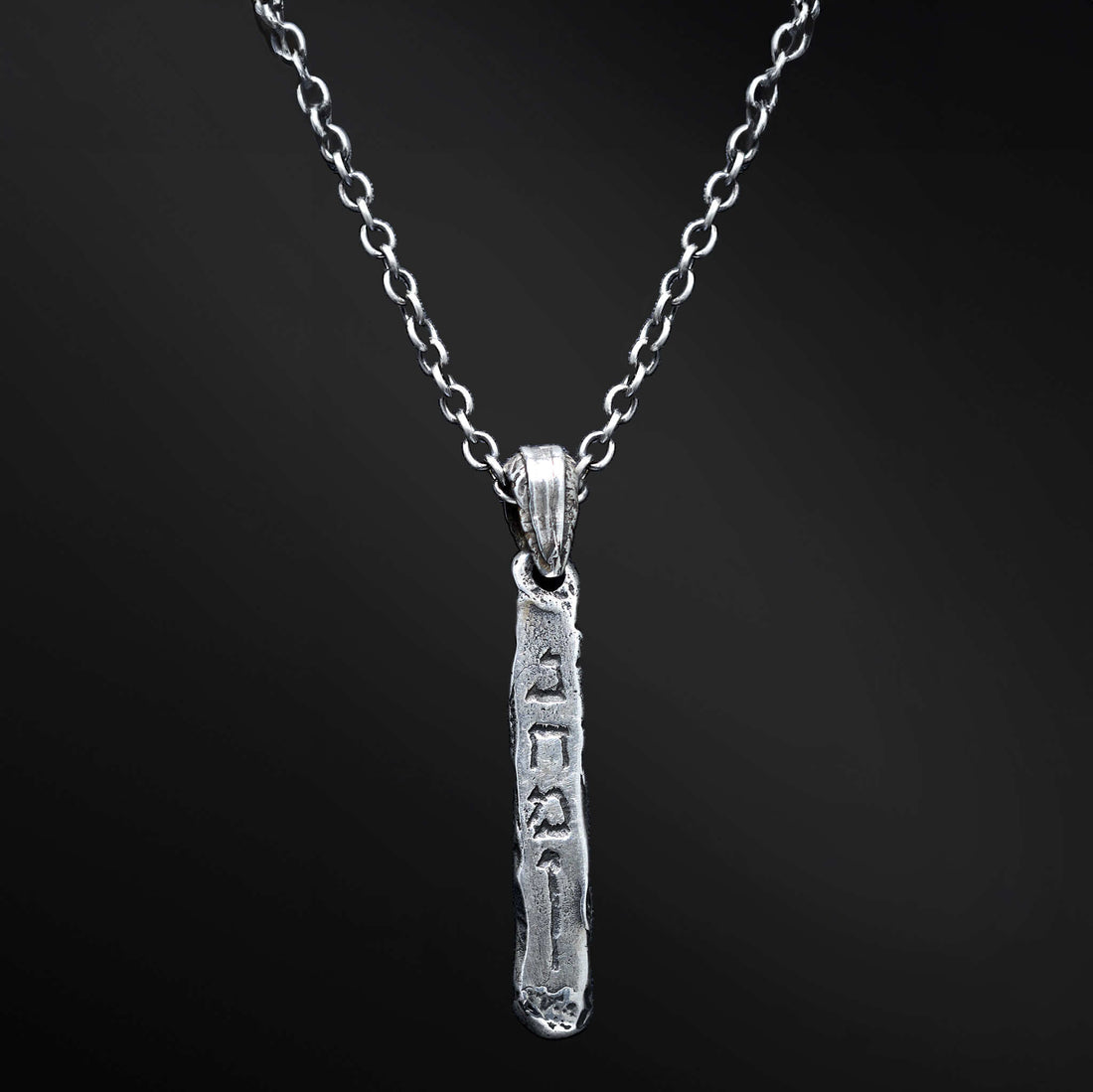 &quot;Markel Pendant: An image of the empowering Markel pendant. The sleek design features an engraving of the word &
