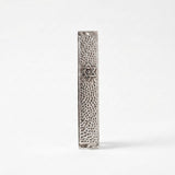 Close-up of hammered silver mezuzah case with engraved Star of David detail, handmade in Israel, Kameart