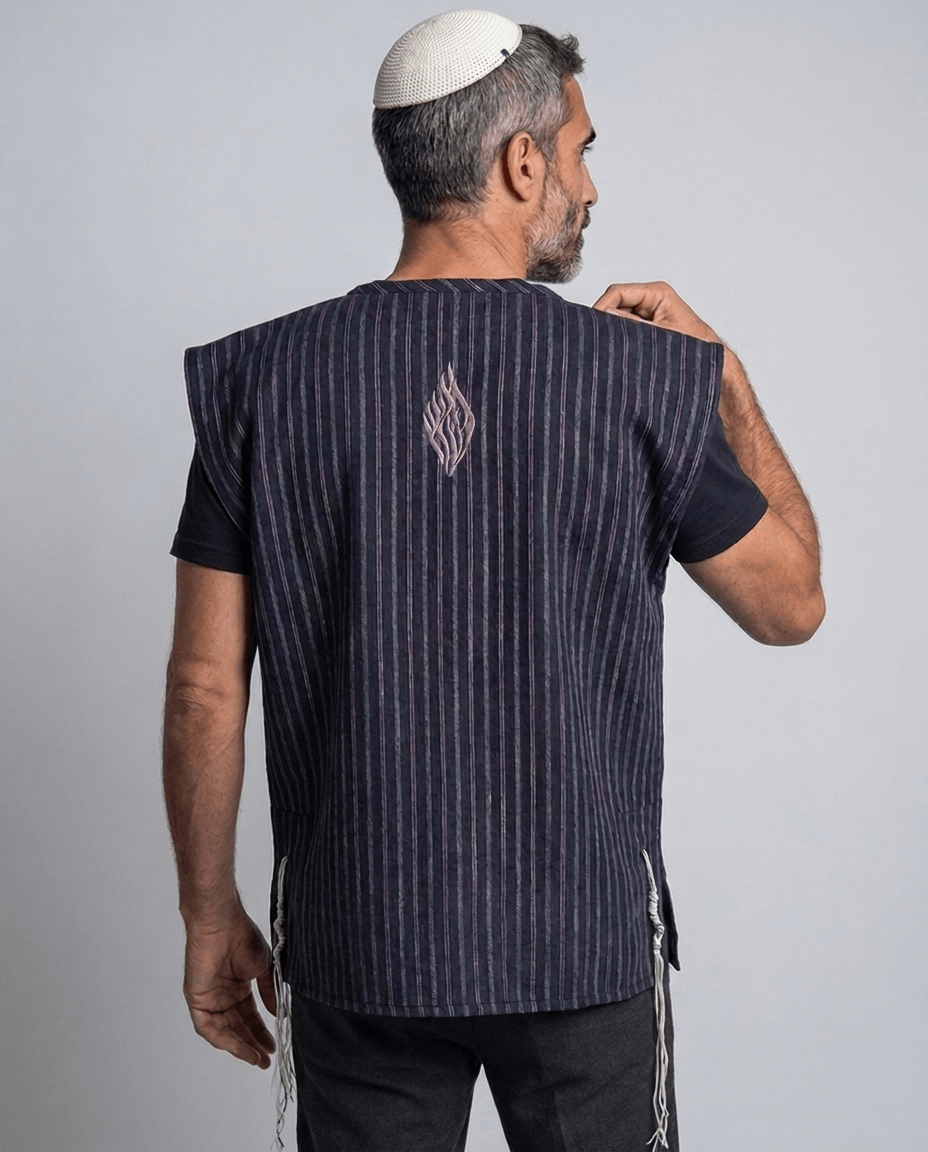 Man wearing tallit katan blue stripes, back view showing the Aesh Sheli flame embroidery, Kameart